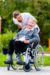 Nurse pushing senior woman in wheelchair on walk Nurse pushing senior woman in wheelchair on walk