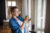 young-woman-standing-indoors-at-home-cleaning-win-2023-11-27-05-33-00-utc